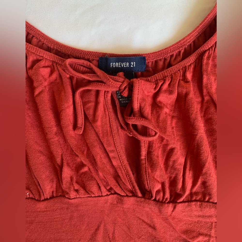 Forever 21 crop top
Very soft material 
Very flattering Crop
Bow tie in front